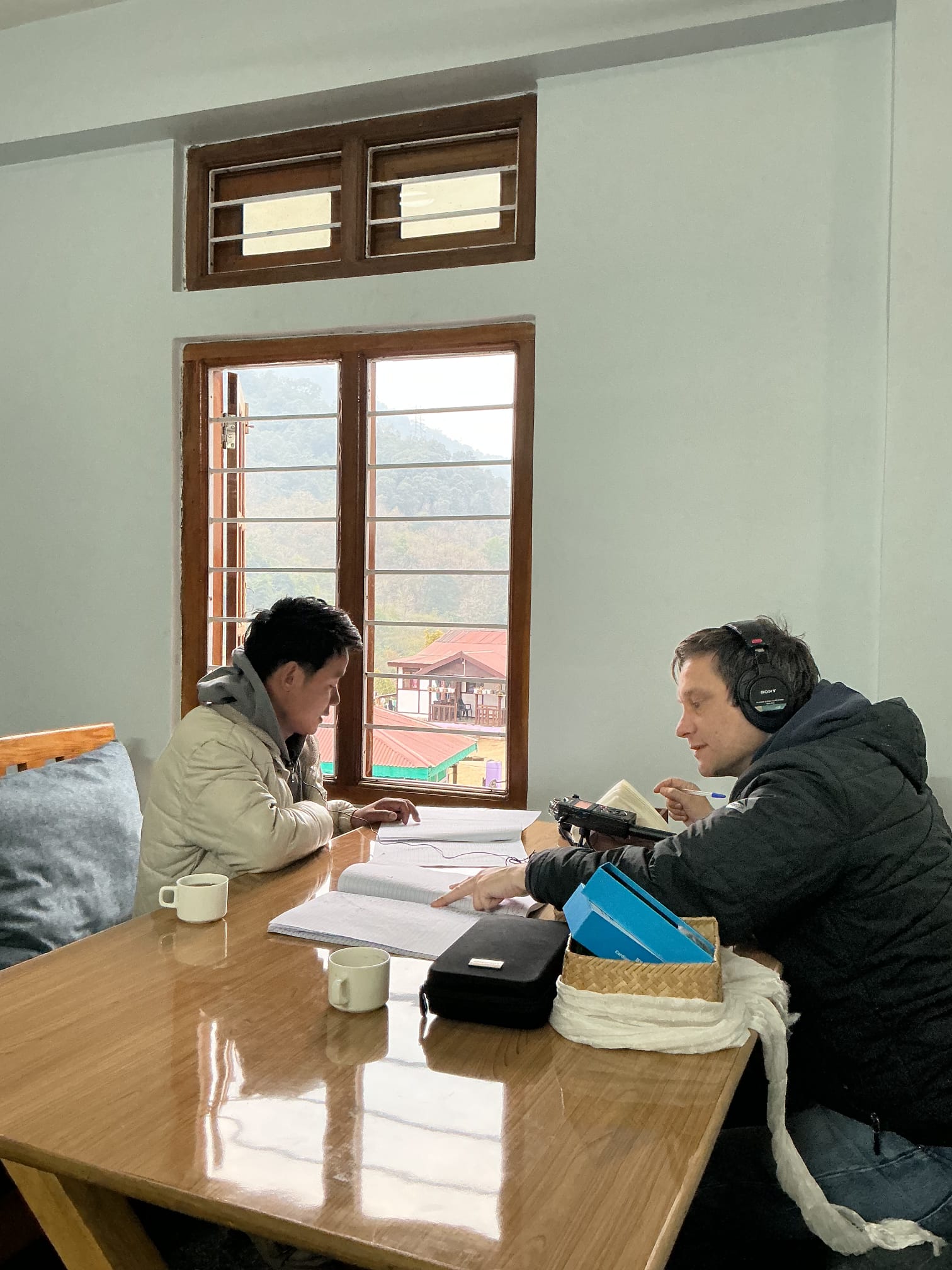 Sani Bachung enlightening Tim about the intricacies of the Bugun language.